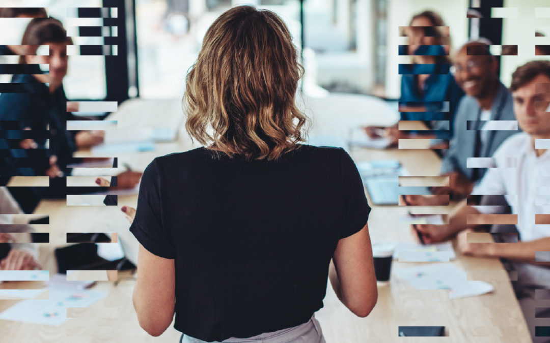 Woman addressing a conference room full of colleagues with a graphical overlay. The featured image for Golden Spiral's article, "Get Quoted at the Buyer's Table."